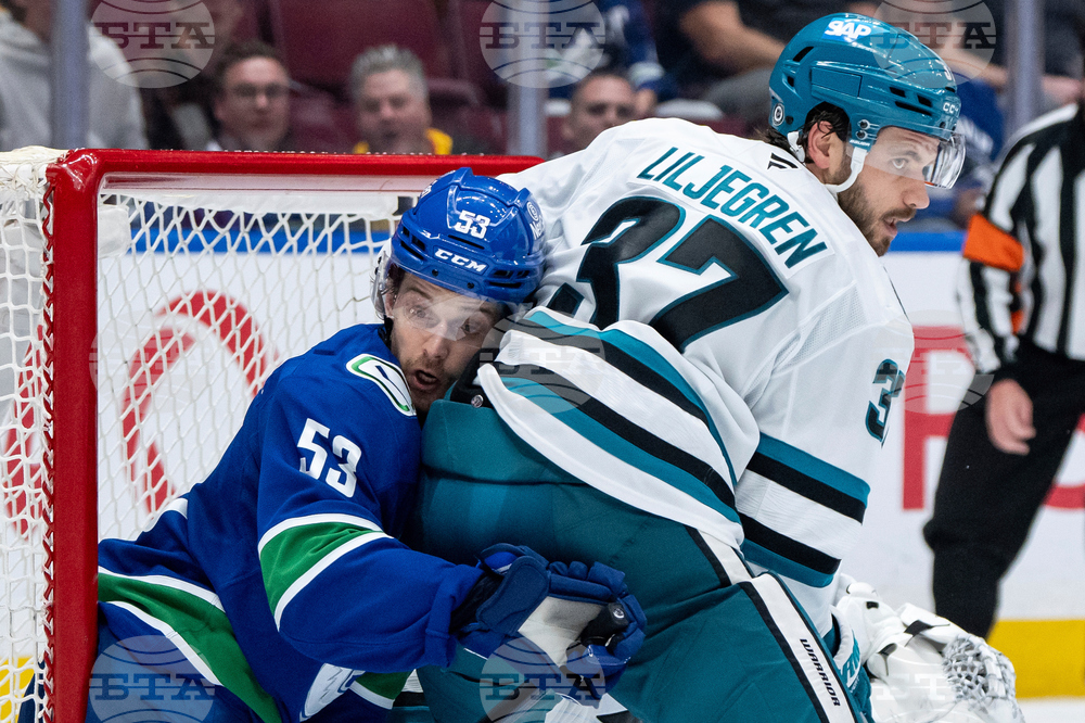 APTOPIX Sharks Canucks Hockey