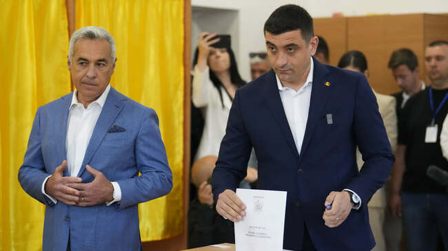George Simion, Calin Georgescu Vote Together in Romania's Presidential Election First Round