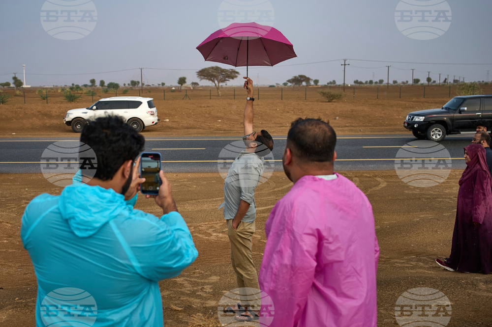 APTOPIX Emirates Rain