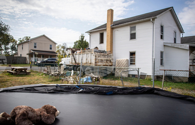 Infants Remains-Woman Charged