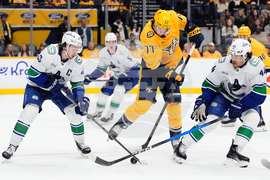 APTOPIX Canucks Predators Hockey