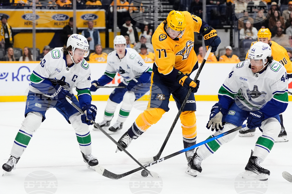 APTOPIX Canucks Predators Hockey