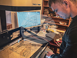 Екип от Геолого-географския факултет на СУ изследва и дигитализира уникални географски източници в Зографския манастир. Снимка: СУ