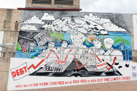 At G20 Summit in Johannesburg, Massive Mural Demands Debt Justice