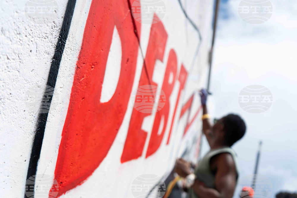 At G20 Summit in Johannesburg, Massive Mural Demands Debt Justice