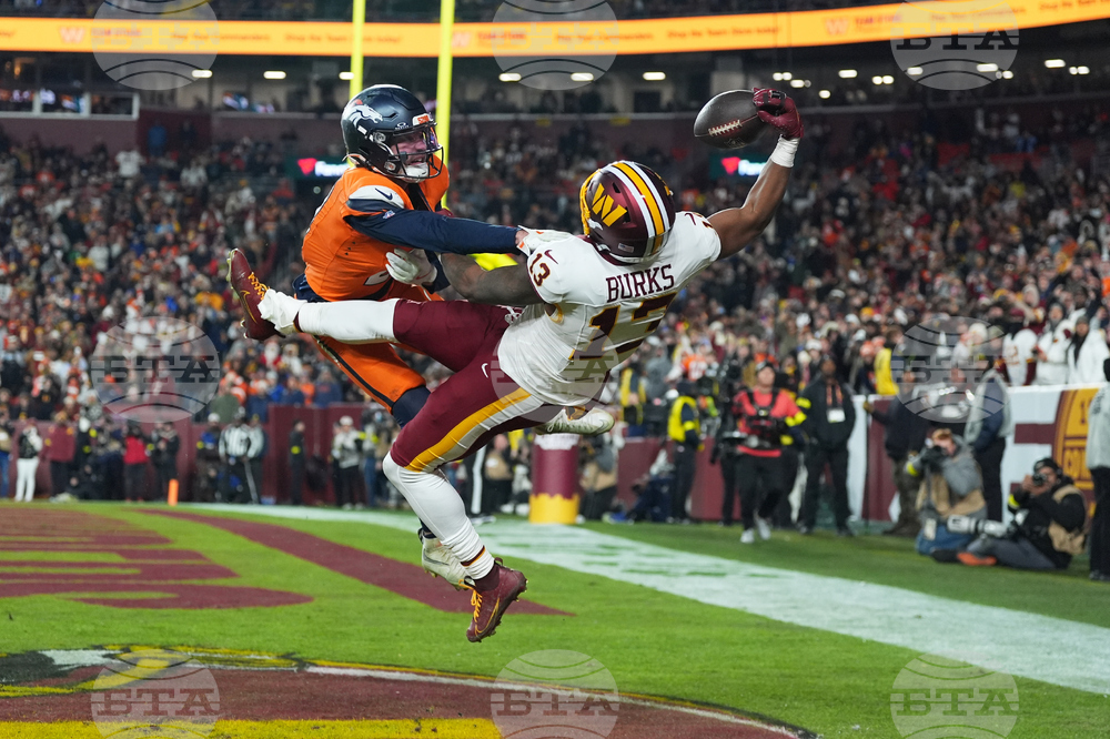 APTOPIX Broncos Commanders Football