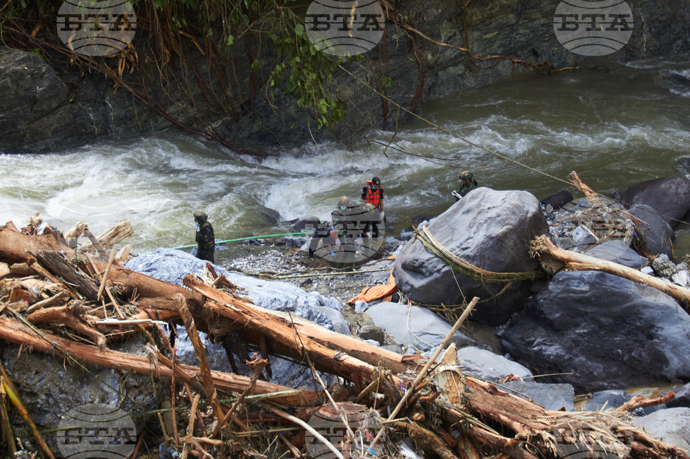 CORRECTION Indonesia Extreme Weather Asia Flooding