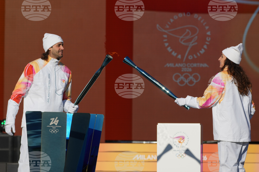 CORRECTION Italy Olympics Milan Cortina Flame