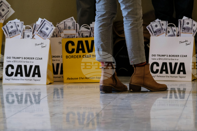 Activists Expose Border Czar with Cava "Bribe Bags"