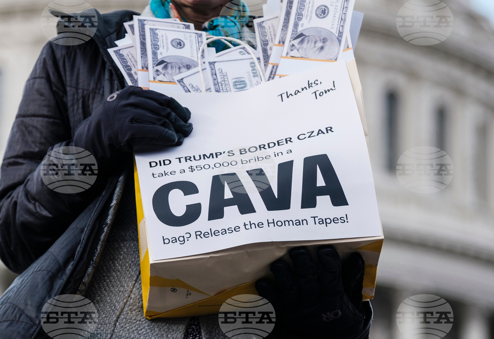 Activists Expose Border Czar with Cava "Bribe Bags"