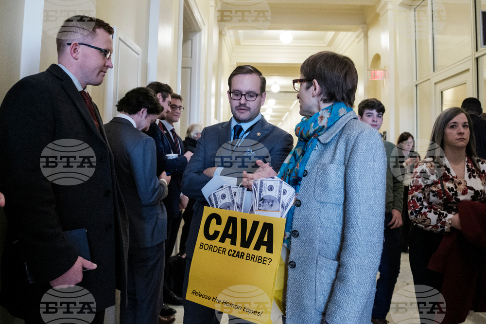 Activists Expose Border Czar with Cava "Bribe Bags"