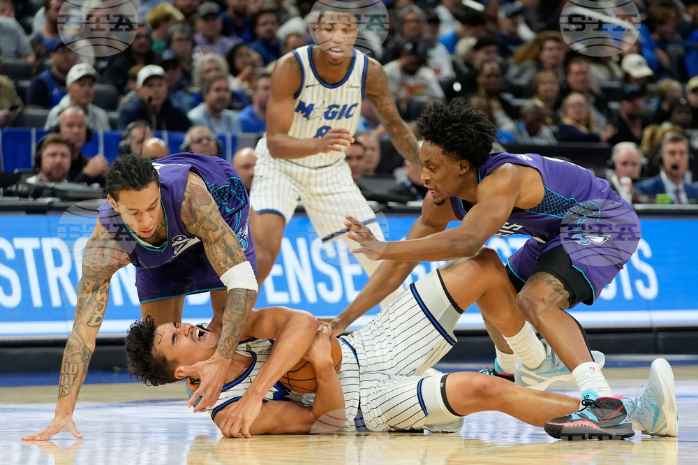 APTOPIX Hornets Magic Basketball