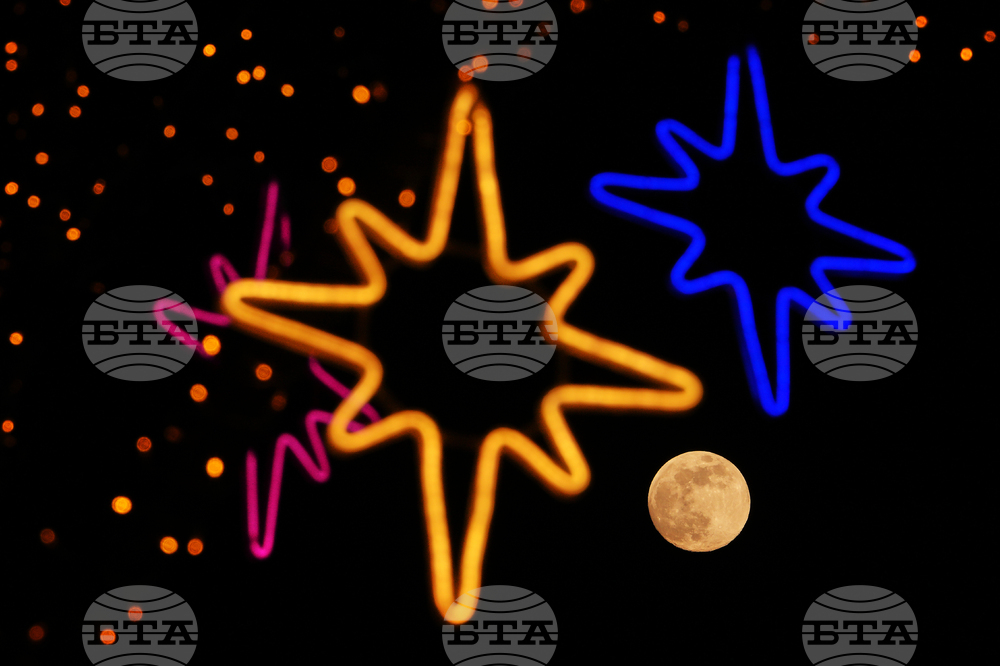 APTOPIX China Wolf Supermoon