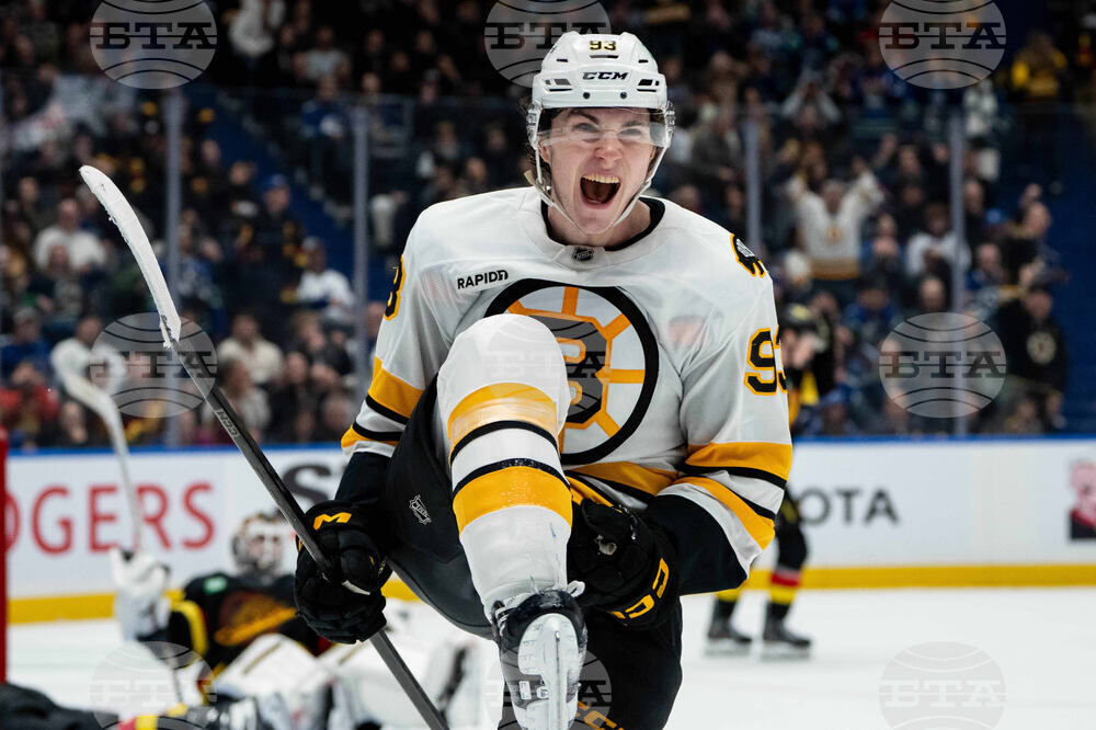 APTOPIX Bruins Canucks Hockey