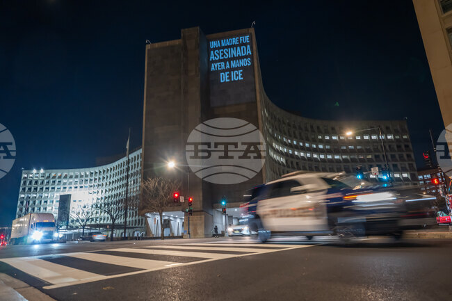 Activists Project Message Condemning ICE After Killing of Minneapolis Woman