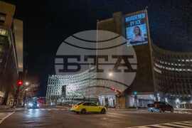 Activists Project Message Condemning ICE After Killing of Minneapolis Woman