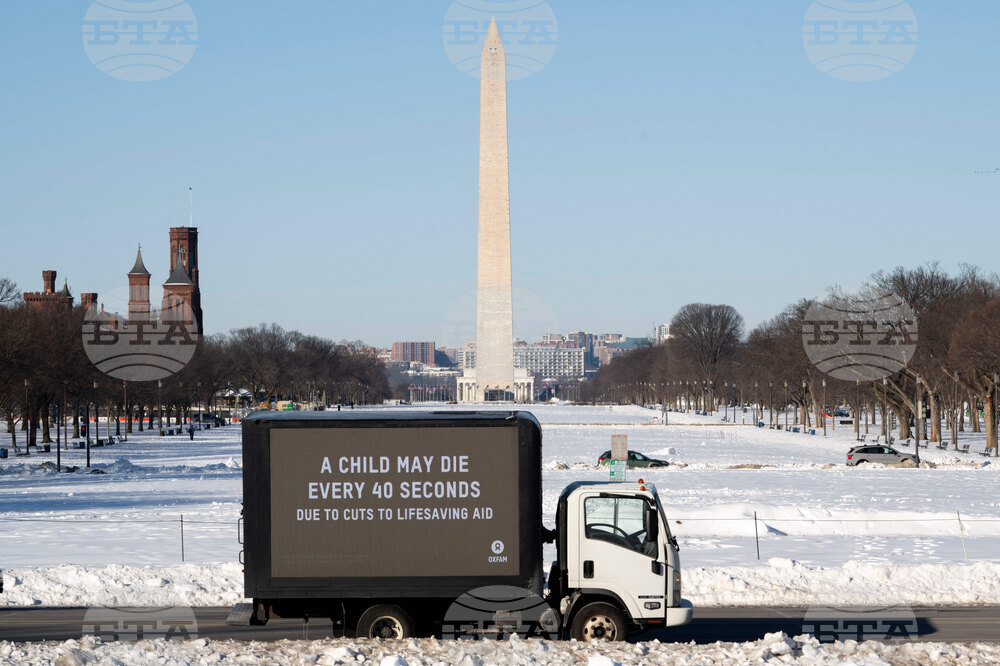 Oxfam mobile billboard in DC marks one year of President Trump's humanitarian aid and USAID cuts