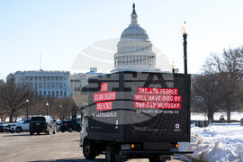 Oxfam mobile billboard in DC marks one year of President Trump's humanitarian aid and USAID cuts