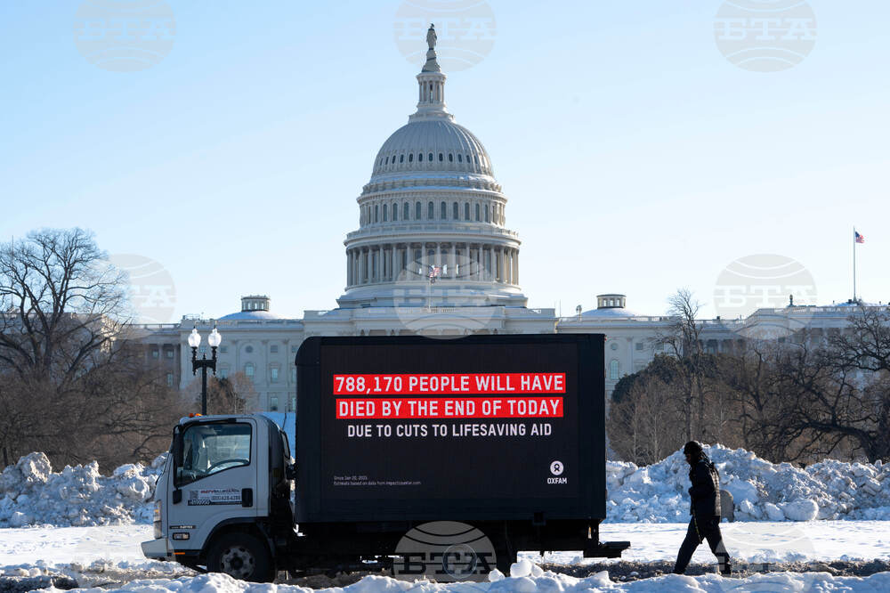 Oxfam mobile billboard in DC marks one year of President Trump's humanitarian aid and USAID cuts