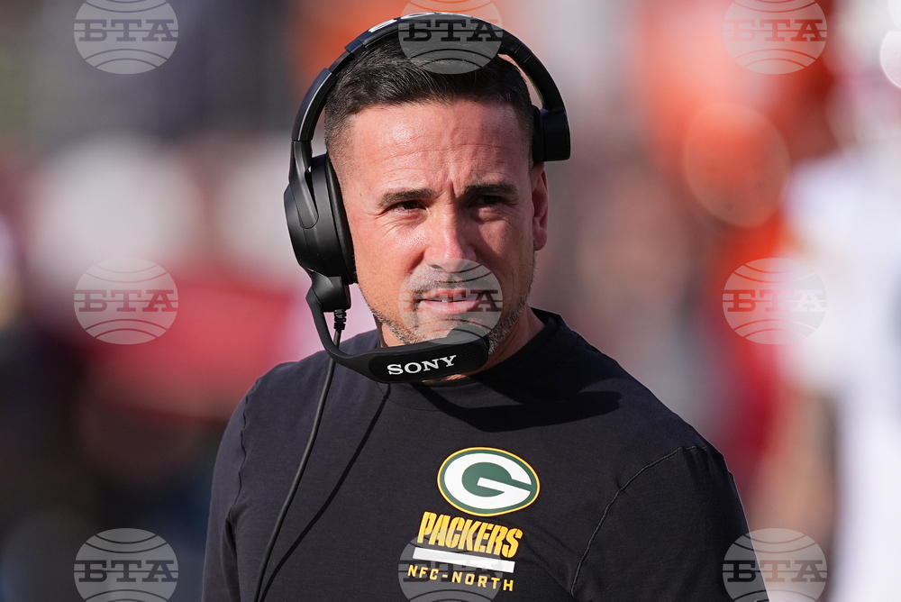 Packers Staff Moves Football