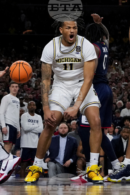APTOPIX NCAA UConn Michigan Basketball