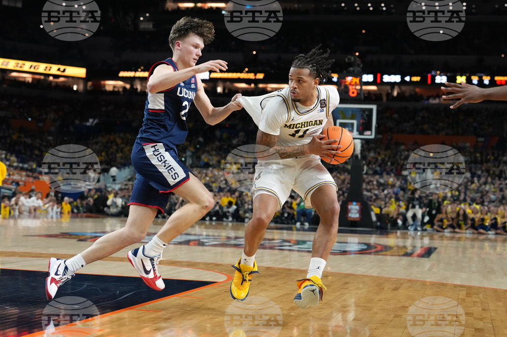 APTOPIX NCAA UConn Michigan Basketball