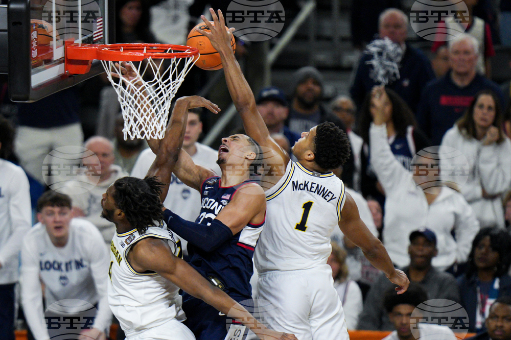 NCAA UConn Michigan Basketball