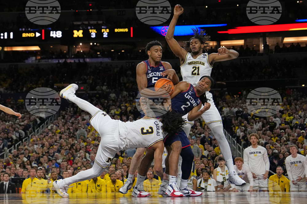 APTOPIX NCAA UConn Michigan Basketball