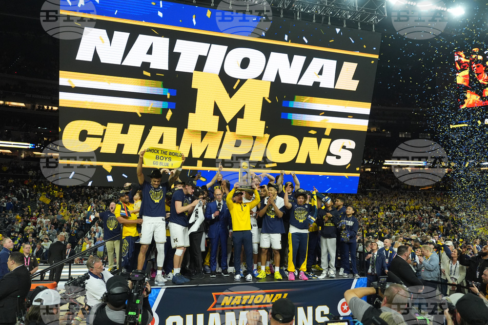 APTOPIX NCAA UConn Michigan Basketball