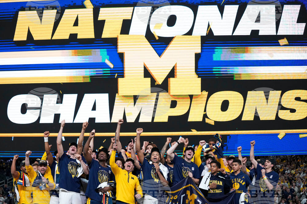 APTOPIX NCAA UConn Michigan Basketball