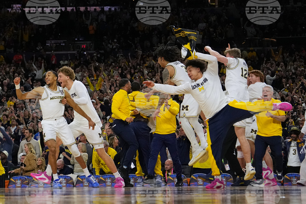 APTOPIX NCAA UConn Michigan Basketball
