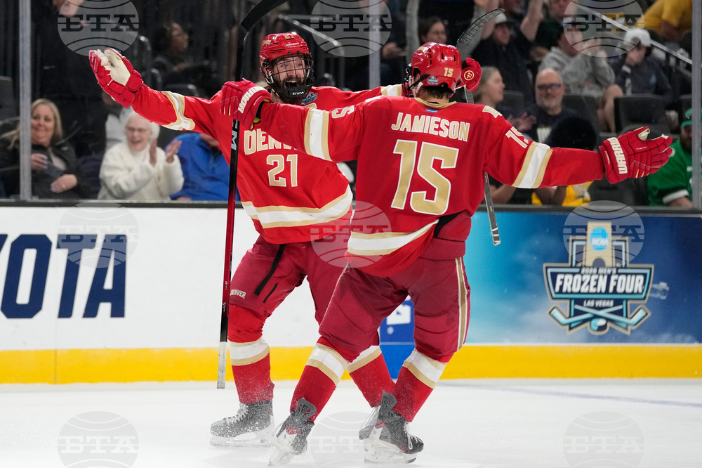 APTOPIX NCAA Michigan Denver Hockey