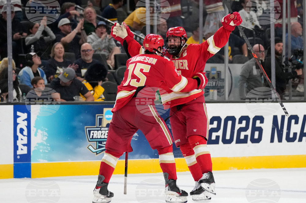 APTOPIX NCAA Michigan Denver Hockey