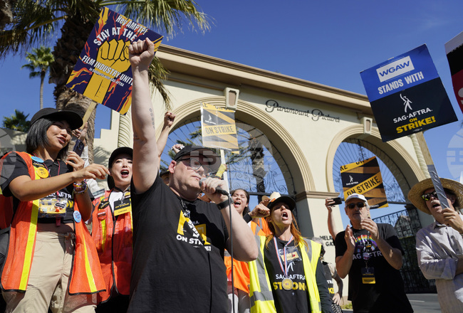 Striking Workers Rise