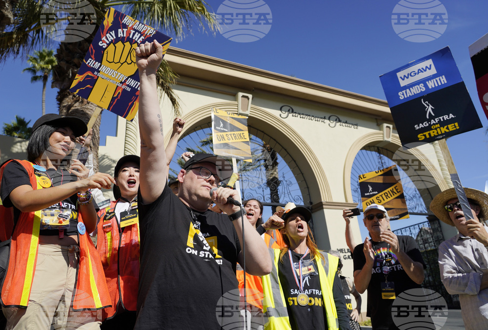 Striking Workers Rise