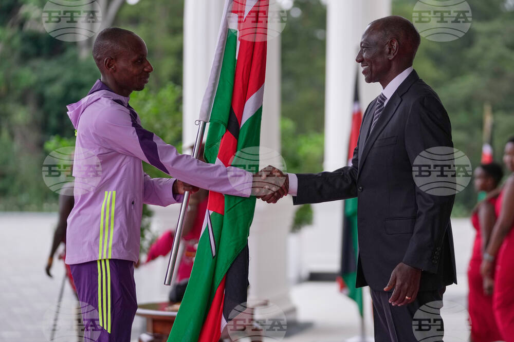 CORRECTION Kenya Marathon Record Breaker