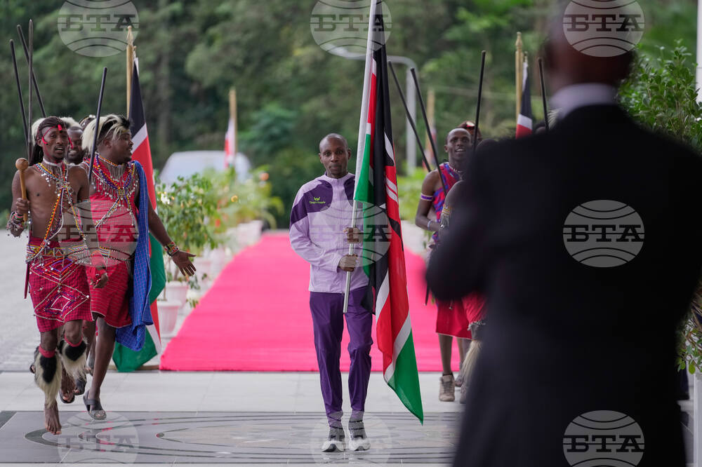 CORRECTION Kenya Marathon Record Breaker