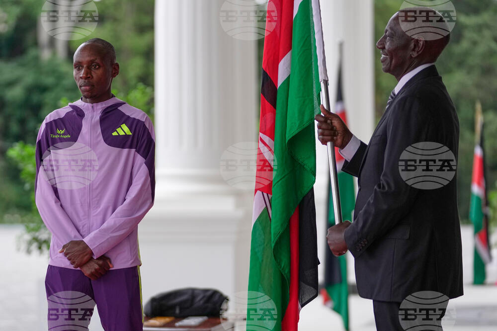 CORRECTION Kenya Marathon Record Breaker