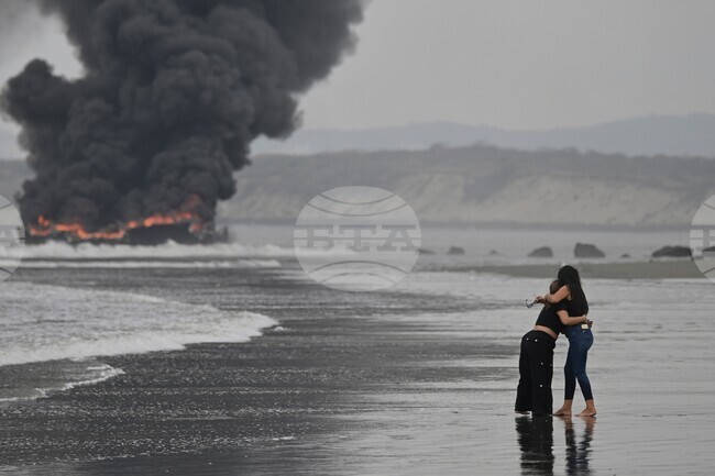 APTOPIX Ecuador Boats Fire