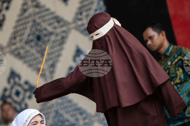 APTOPIX Indonesia Caning