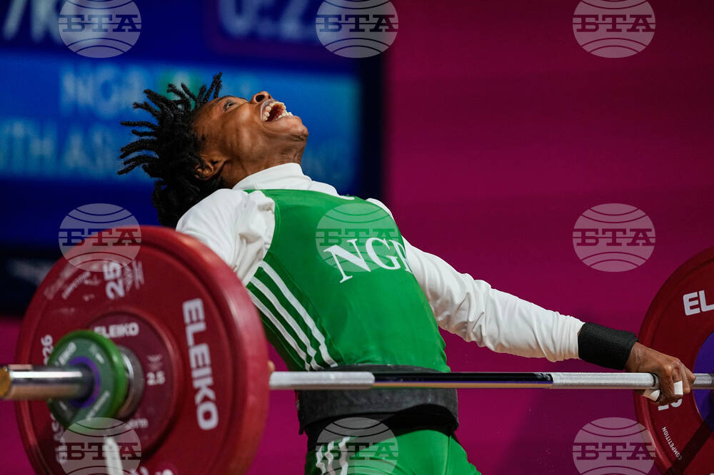 APTOPIX Britain Commonwealth Games Weightlifting