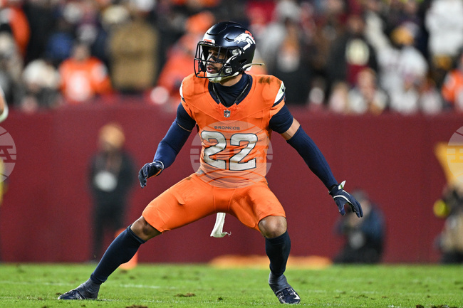 Broncos Jones' Kicks Football