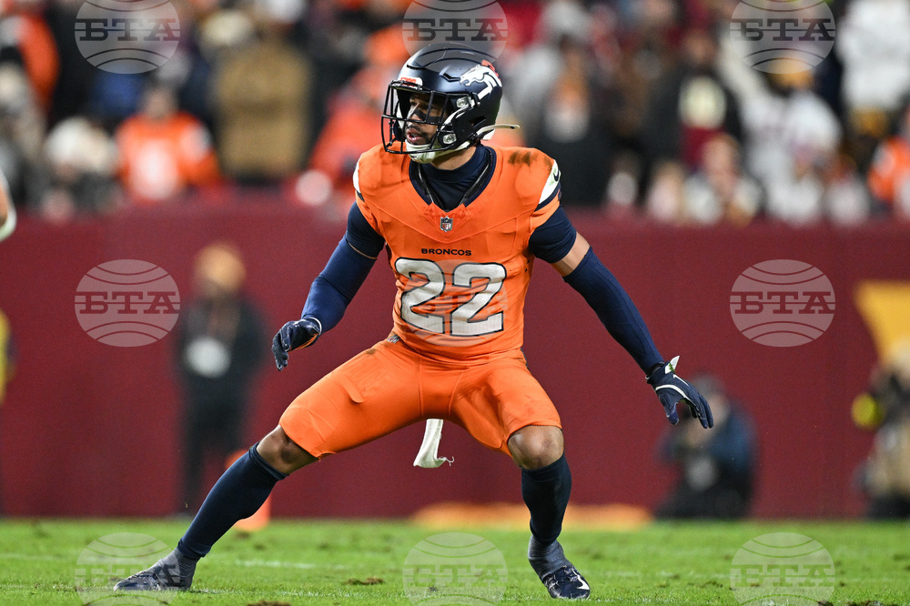Broncos Jones' Kicks Football