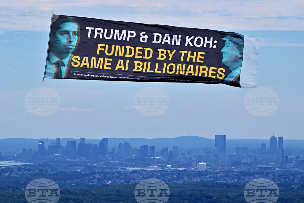 Aerial Banner References Dan Koh and AI Backers Ahead of MA-06 Primary