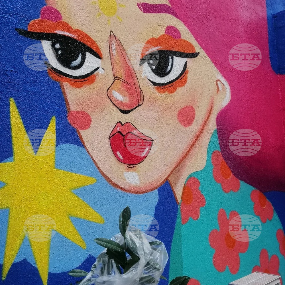 Female Street Artist Creates Mural Against Domestic Violence