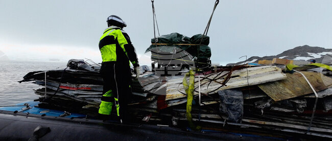 The Bulgarian naval research vessel Sv. Sv. Kiril i Metodii (RSV 421) crew and the logistics team at the Bulgarian Antarctic base clean the shore